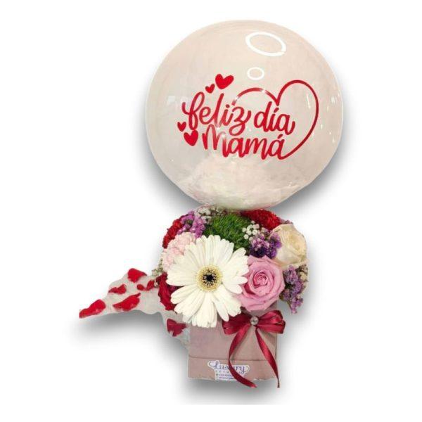 Ramillete de flores con rosas, gerberas y otras flores de temporada con una base decorativa de lujo y cinta.